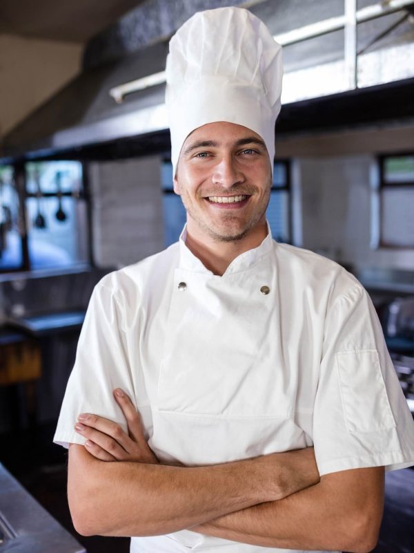 male-chef-standing-with-arms-crossed-in-kitchen.jpg